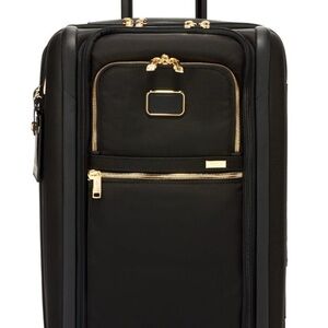 Tumi International Dual Access 4 Wheeled Carry On. Black and gold accent.